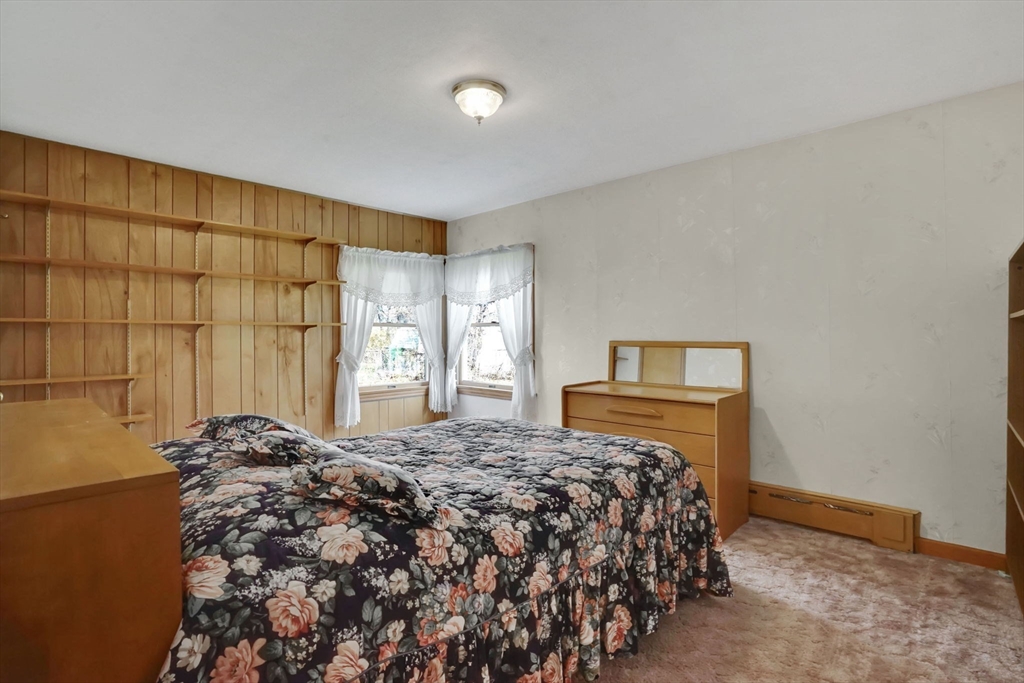 76 Roy Street Chicopee, MA 01013 - Photo 18 of 30 a bedroom with a bed and a window