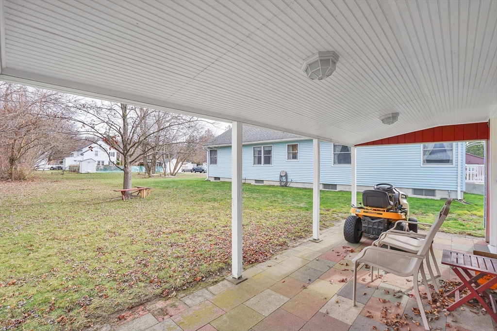 76 Roy Street Chicopee, MA 01013 - Photo 27 of 30 a patio with table and chairs