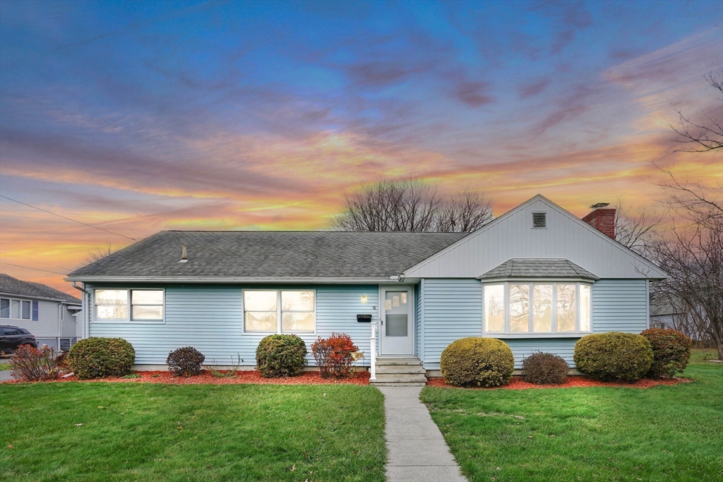 76 Roy Street Chicopee, MA 01013 - Photo 30 of 30 a front view of a house with a yard and garage