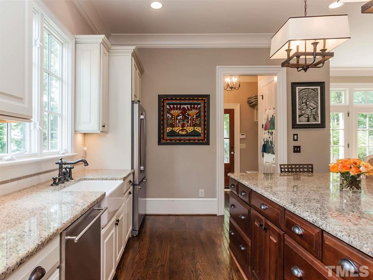 416 Wayne Drive Raleigh, NC 27608 - Photo 11 of 25 a bathroom with a granite countertop sink a large mirror and a shower