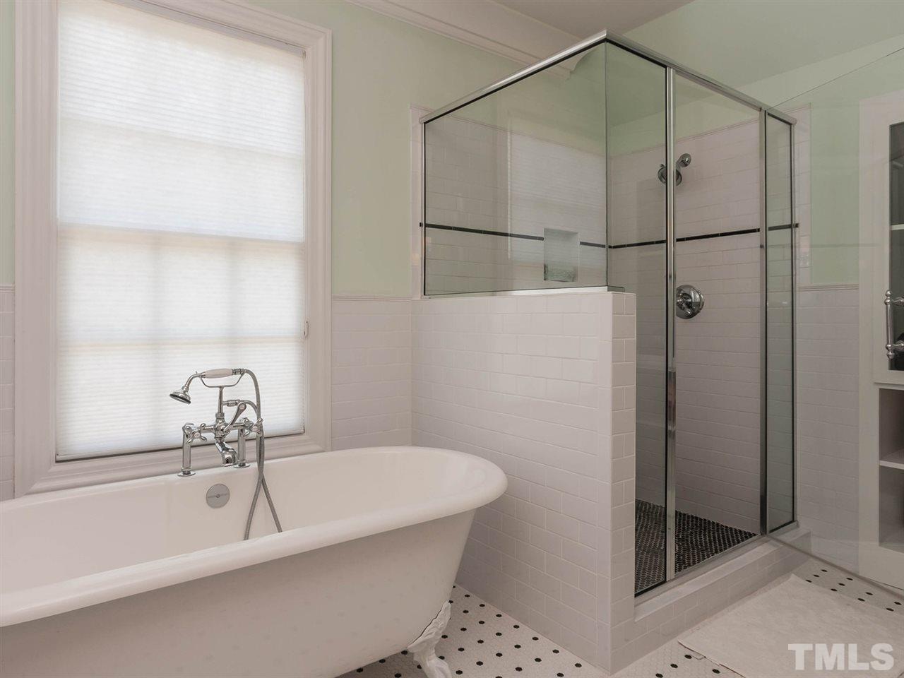 416 Wayne Drive Raleigh, NC 27608 - Photo 18 of 25 a bathroom with a bathtub and shower