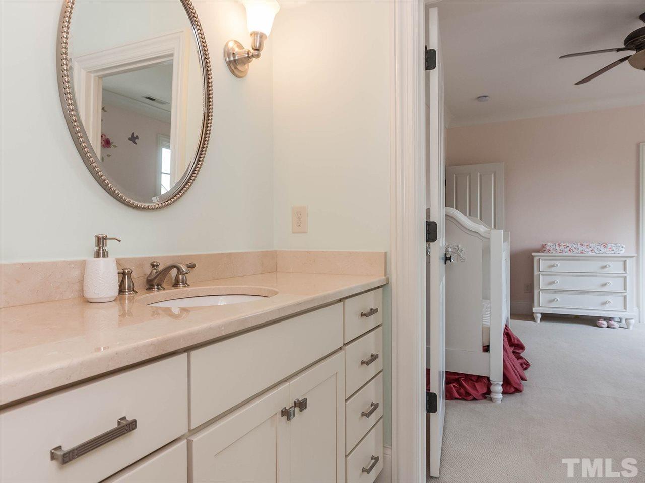 416 Wayne Drive Raleigh, NC 27608 - Photo 20 of 25 a bathroom with a sink and a mirror
