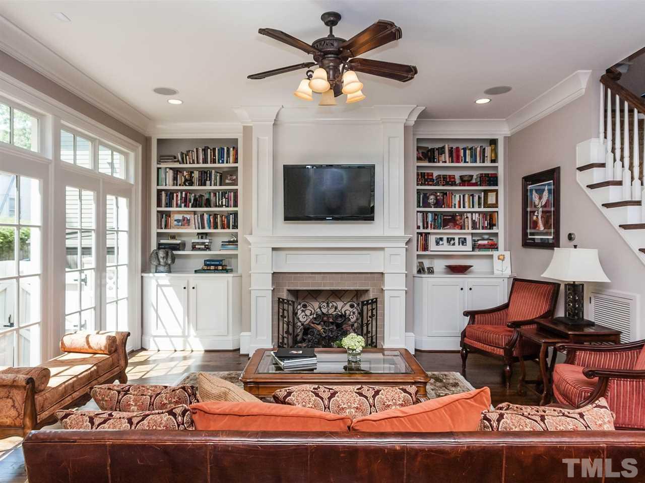 416 Wayne Drive Raleigh, NC 27608 - Photo 6 of 25 a living room with furniture fireplace and flat screen tv