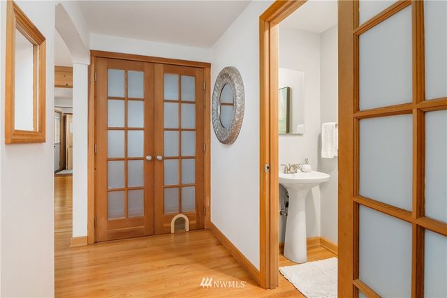a living room with furniture a lamp and a fireplace