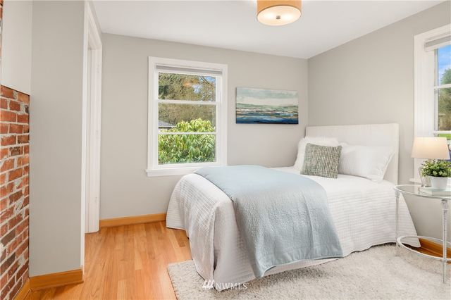 a view of a hallway with a door and windows