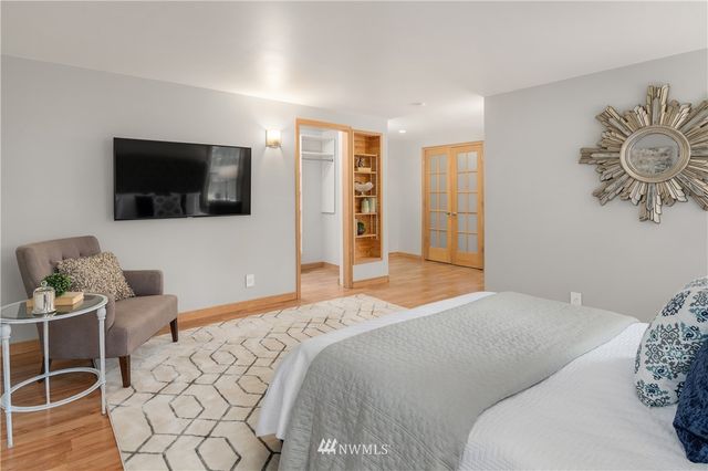 a bedroom with a bed and a couch