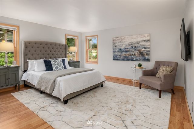 a bathroom with a sink a vanity and a mirror