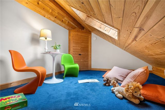 a bedroom with furniture and a lamp