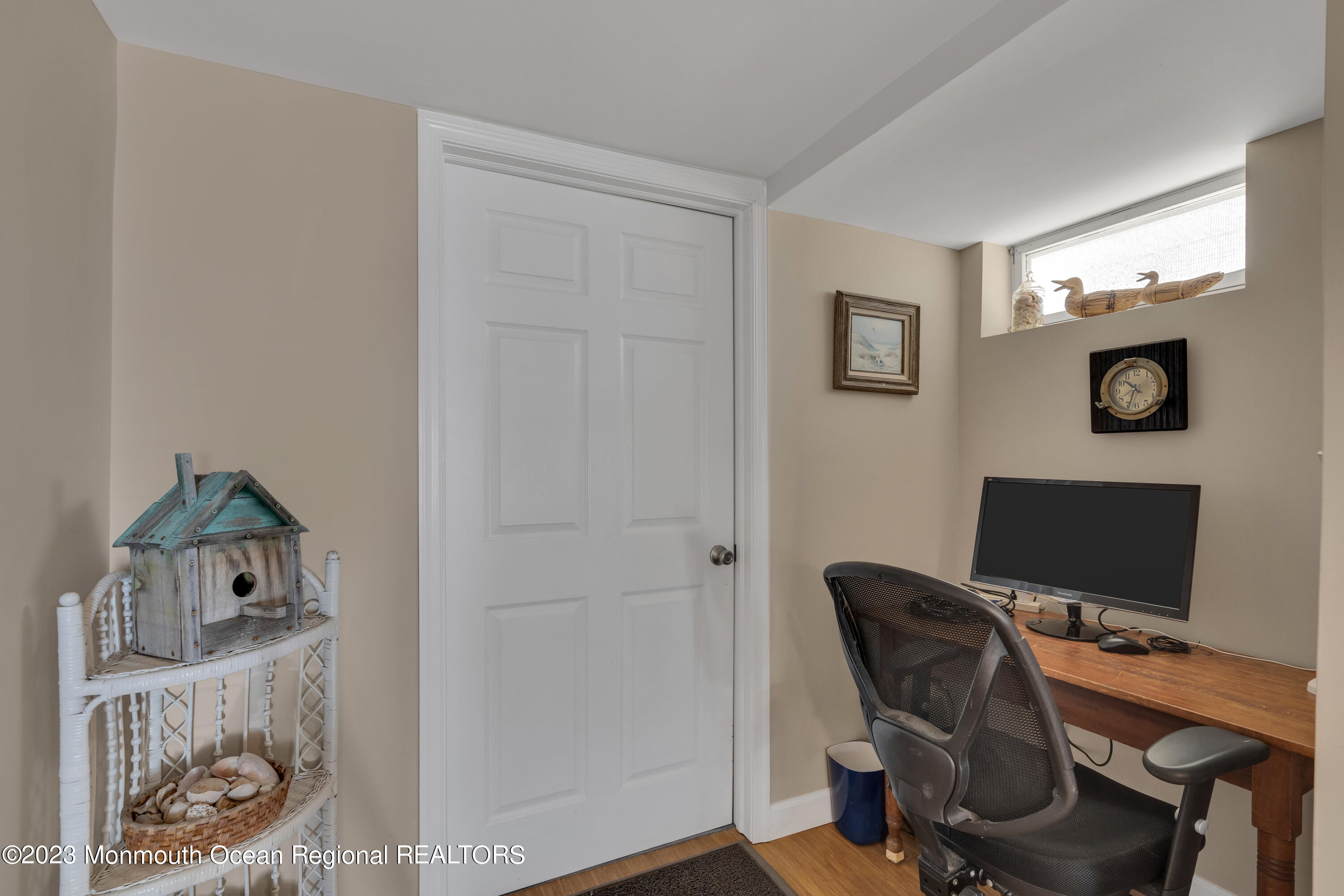 61 Beach Front Manasquan, NJ 08736 - Photo 15 of 20 a view of a workspace with furniture and a window