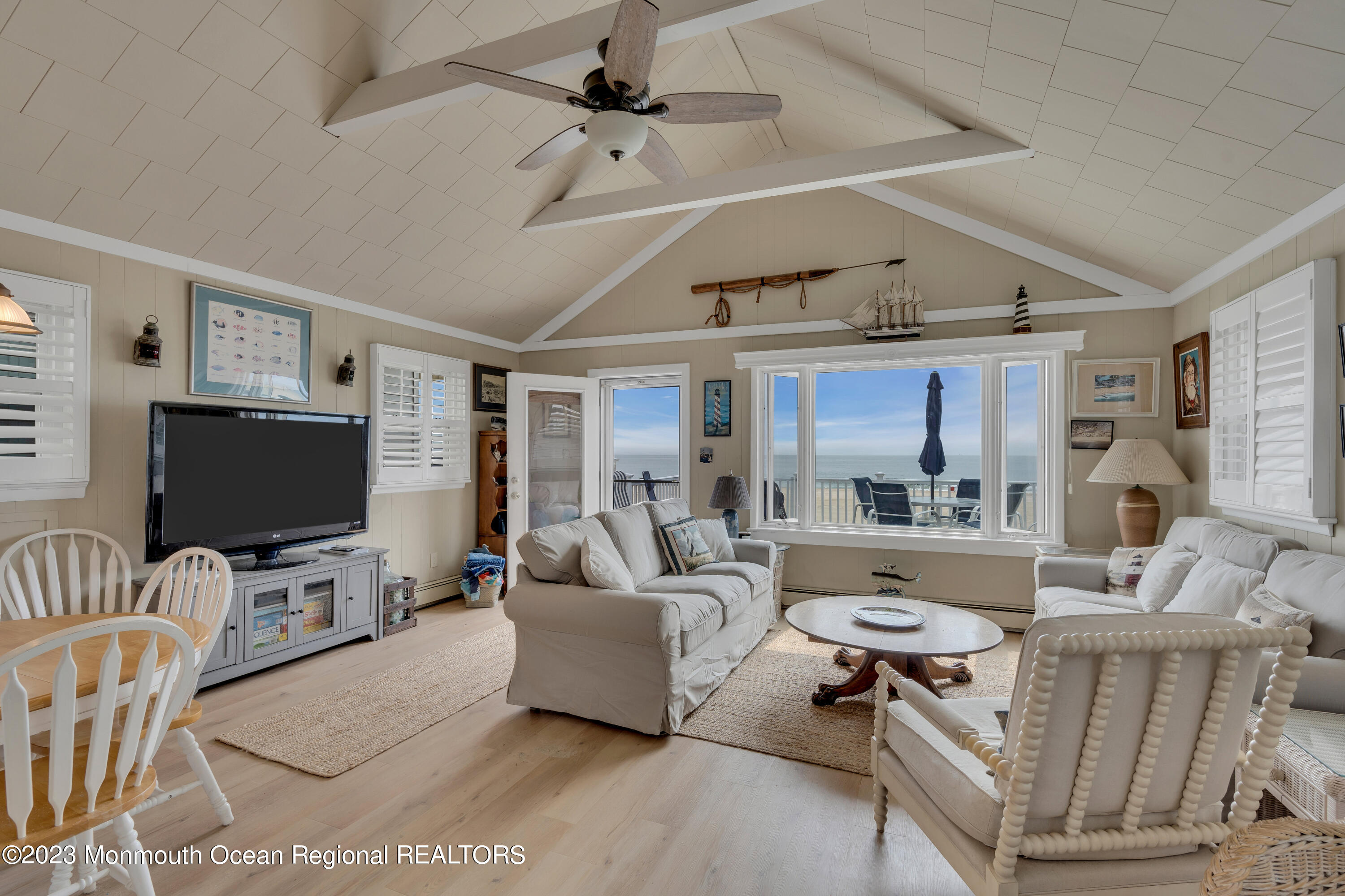 61 Beach Front Manasquan, NJ 08736 - Photo 4 of 20 a living room with furniture and a flat screen tv