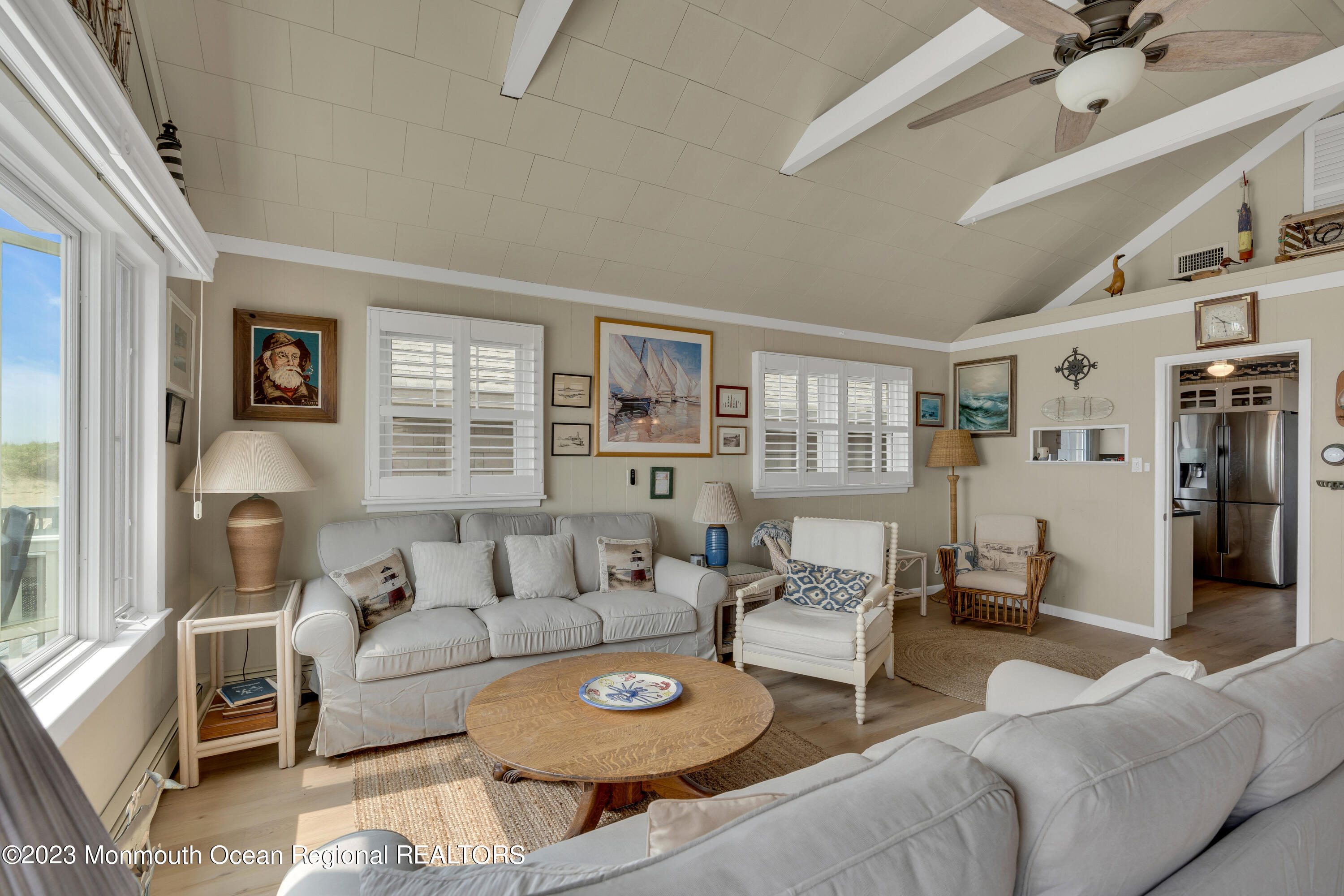 61 Beach Front Manasquan, NJ 08736 - Photo 6 of 20 a living room with furniture and a large window