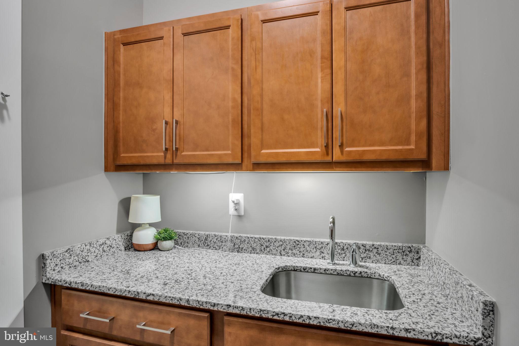 182 Rustic Wood Drive Gettysburg, PA 17325 - Photo 31 of 101 a kitchen with granite countertop a sink and cabinets