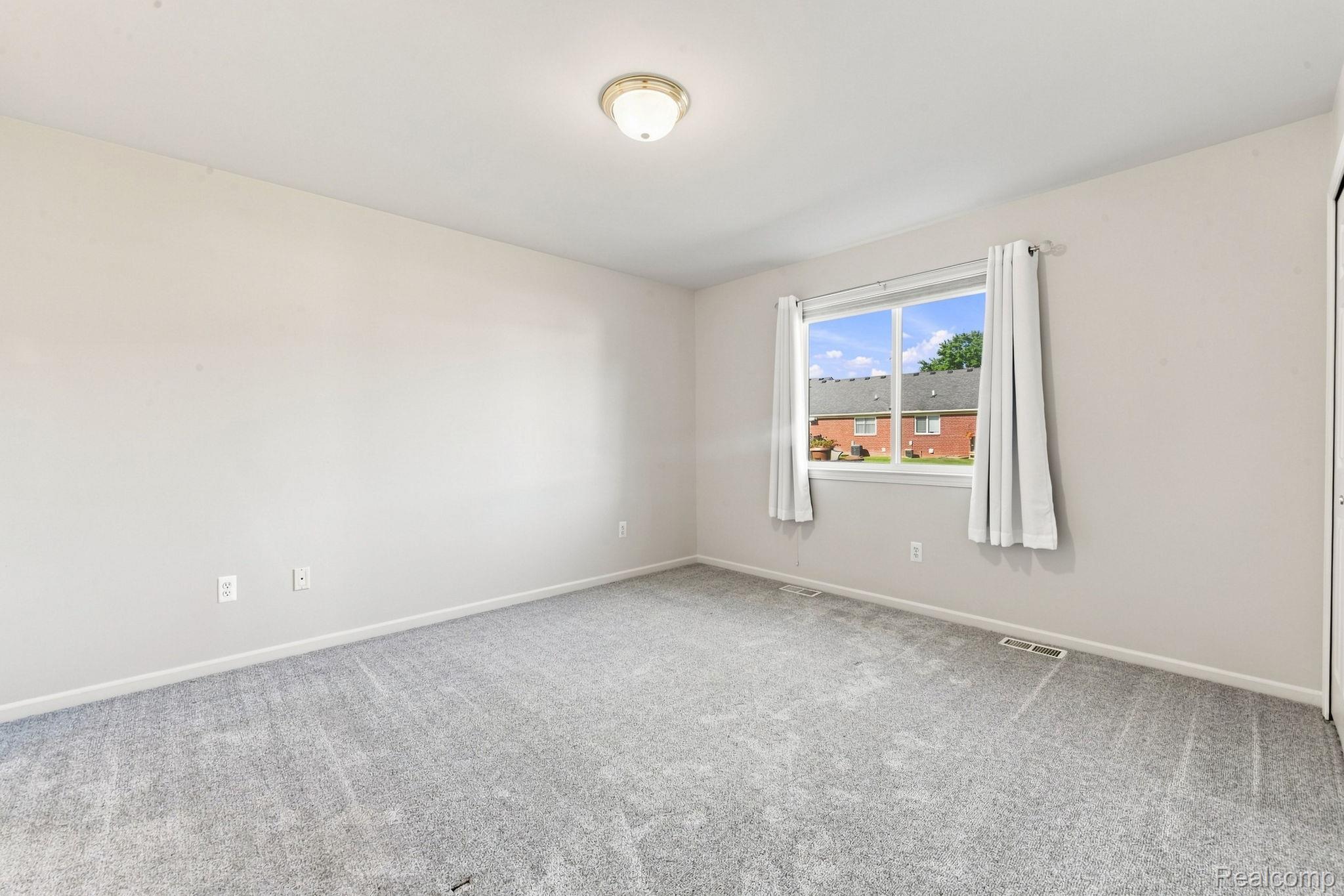 493 Harvard Drive Romeo, MI 48065 - Photo 19 of 36 Neutral wall color, wall-to-wall carpeting, overhead lighting, and a double-hung window