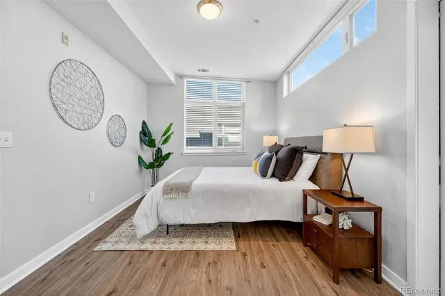 a bedroom with bed and a window