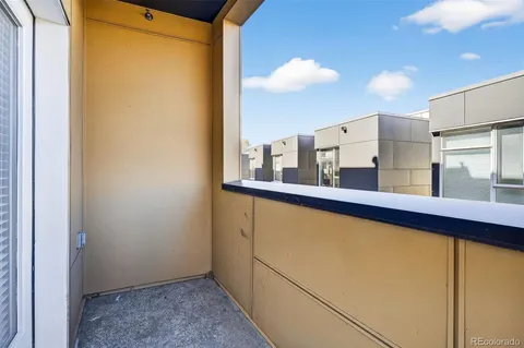 a view of a balcony with chairs