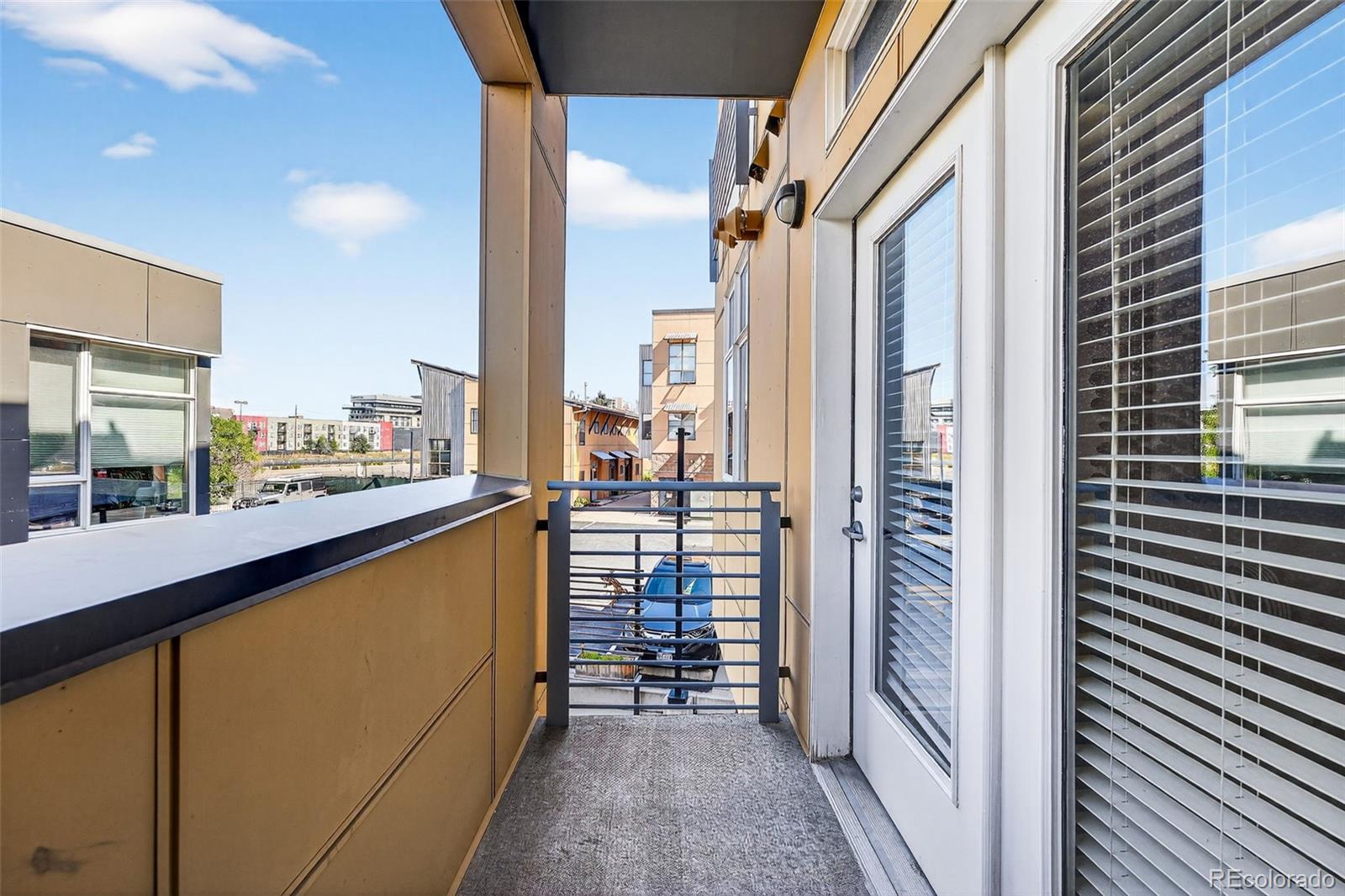3101 Blake Street, Unit 209 Denver, CO 80205 - Photo 28 of 33 a view of a balcony with chairs