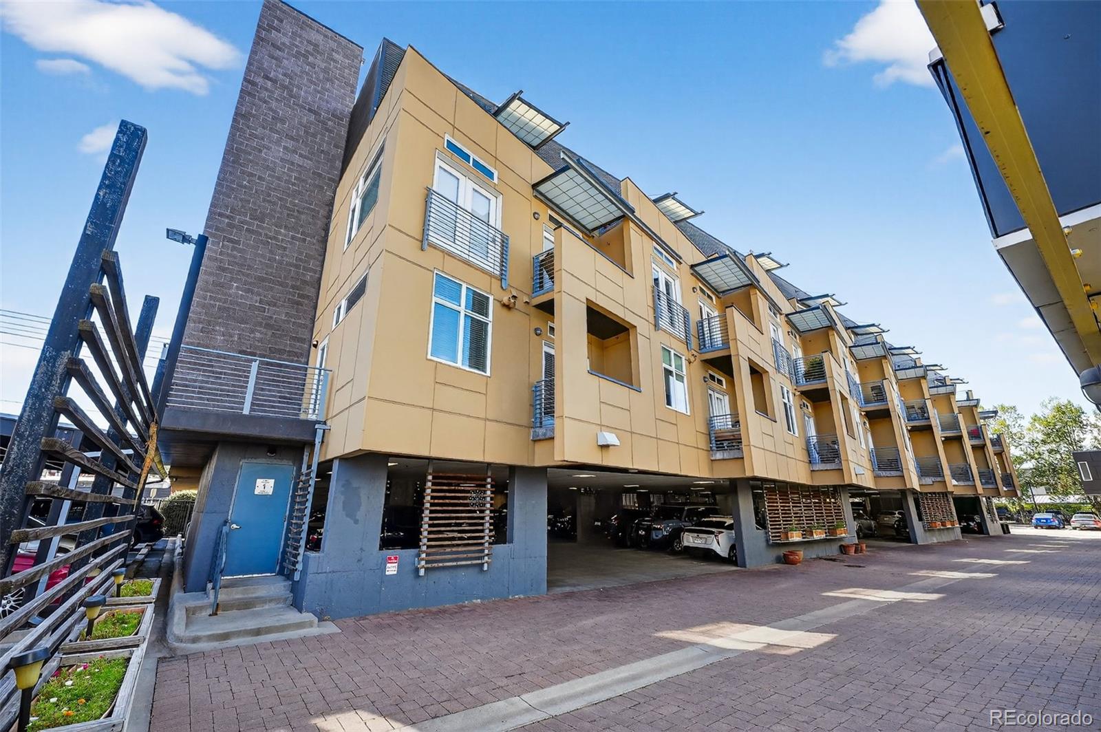 3101 Blake Street, Unit 209 Denver, CO 80205 - Photo 30 of 33 a view of a building with many windows
