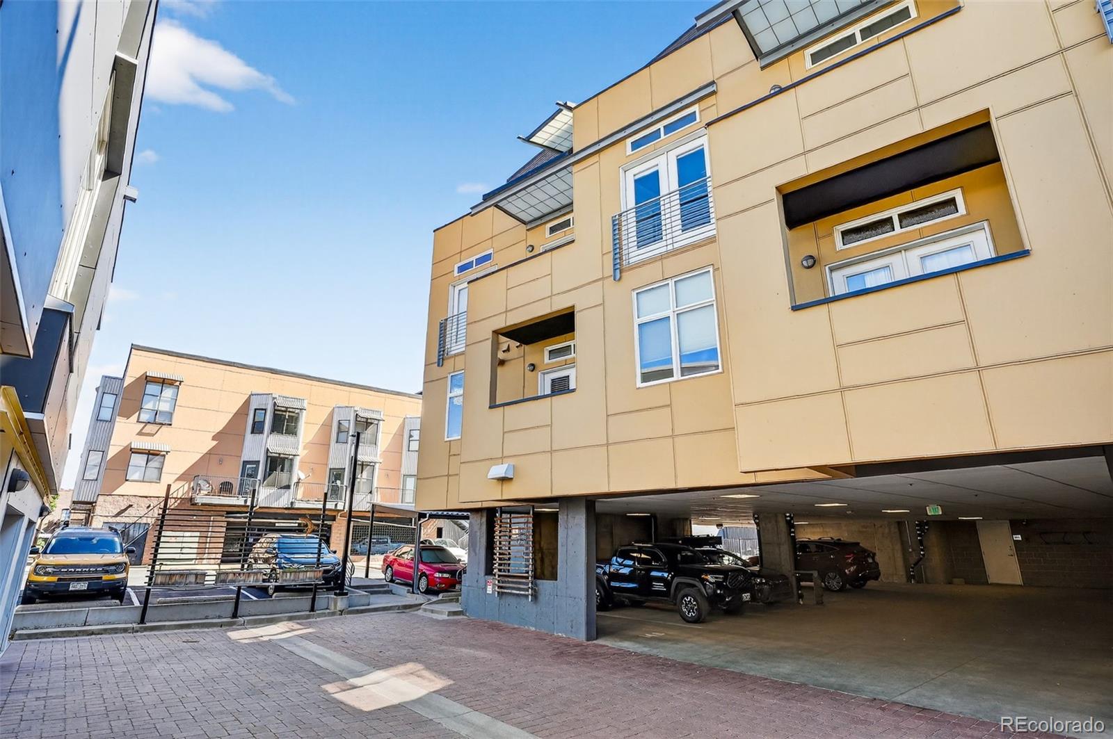 3101 Blake Street, Unit 209 Denver, CO 80205 - Photo 31 of 33 a car parked in front of a building