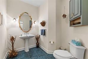 335 Red Oak Court, Unit 335 Monroeville, PA 15146 - Photo 12 of 50 a bathroom with a toilet a sink and mirror