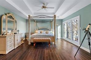 335 Red Oak Court, Unit 335 Monroeville, PA 15146 - Photo 14 of 50 a bedroom with a bed and a chandelier