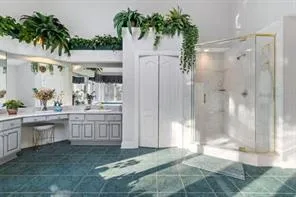 a spacious bedroom with a bed and a window