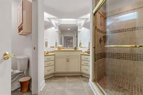 335 Red Oak Court, Unit 335 Monroeville, PA 15146 - Photo 31 of 50 a bathroom with a sink a toilet and shower