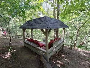 a view of a small house with a roof deck