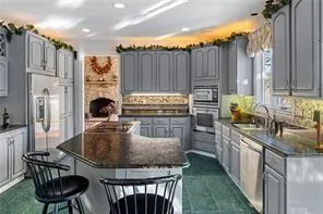 a living room with couches and a dining table with chairs