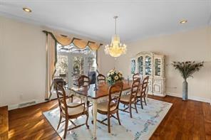 335 Red Oak Court, Unit 335 Monroeville, PA 15146 - Photo 10 of 50 a view of a dining room with furniture and wooden floor