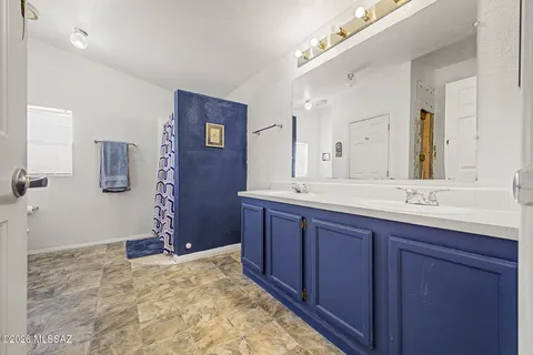a bathroom with a granite countertop sink mirror and a