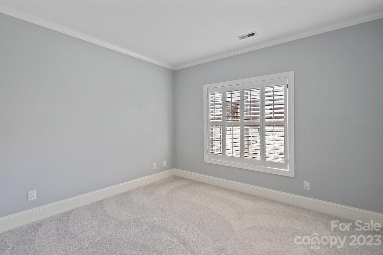4409 Mickleton Road Charlotte, NC 28226 - Photo 14 of 31 a view of an empty room with a window