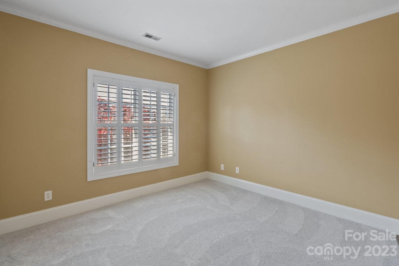 4409 Mickleton Road Charlotte, NC 28226 - Photo 15 of 31 a view of an empty room with a window