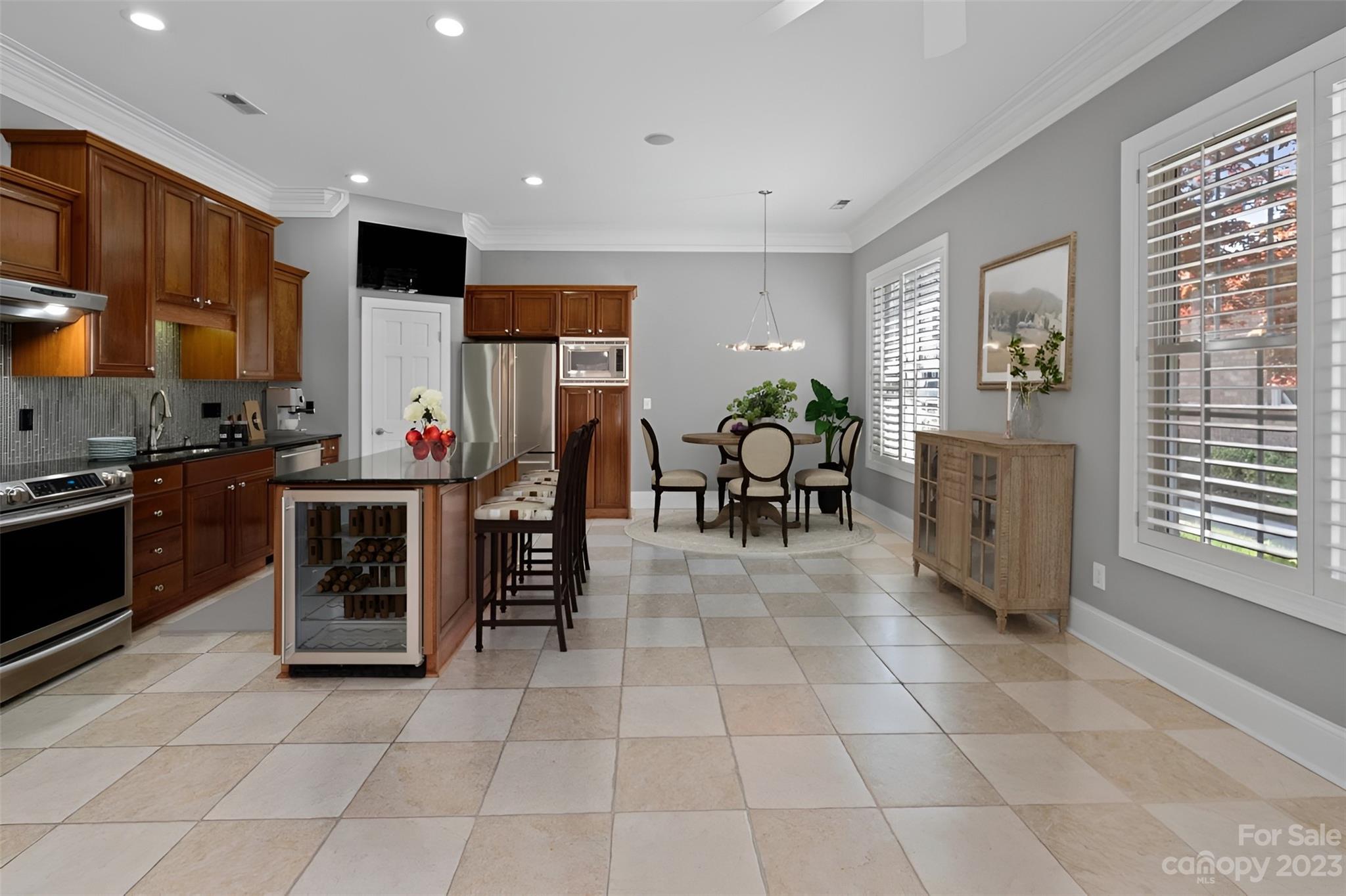 4409 Mickleton Road Charlotte, NC 28226 - Photo 5 of 31 a kitchen with stainless steel appliances a stove a sink dishwasher and a refrigerator with wooden floor