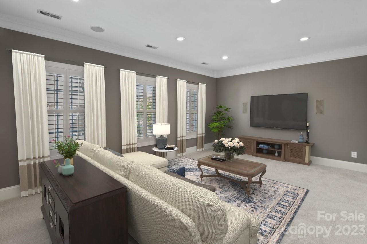 4409 Mickleton Road Charlotte, NC 28226 - Photo 10 of 31 a living room with furniture and a flat screen tv