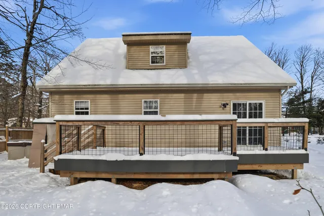 a front view of a house with a large window