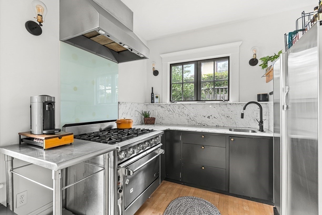 9 Lakeview Terrace Winchester, MA 01890 - Photo 18 of 42 a kitchen with stainless steel appliances granite countertop a sink stove and refrigerator