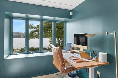 a workspace with furniture and a window