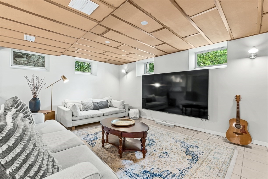 9 Lakeview Terrace Winchester, MA 01890 - Photo 33 of 42 a living room with furniture and a flat screen tv