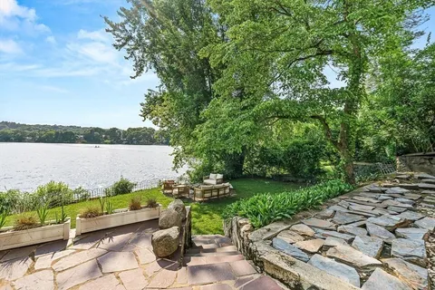 a view of a chairs and table in a backyard