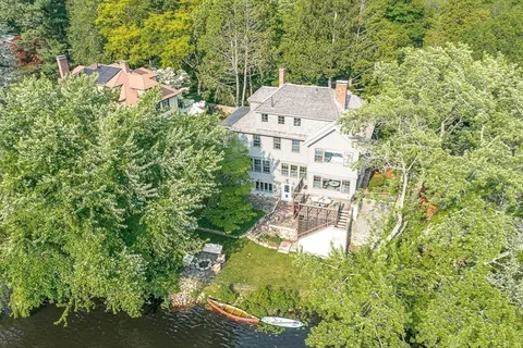 an aerial view of residential house with outdoor space