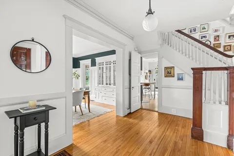 a view of a kitchen with a sink cabinets and wooden floor