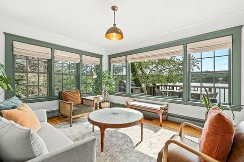 a living room with furniture and a table