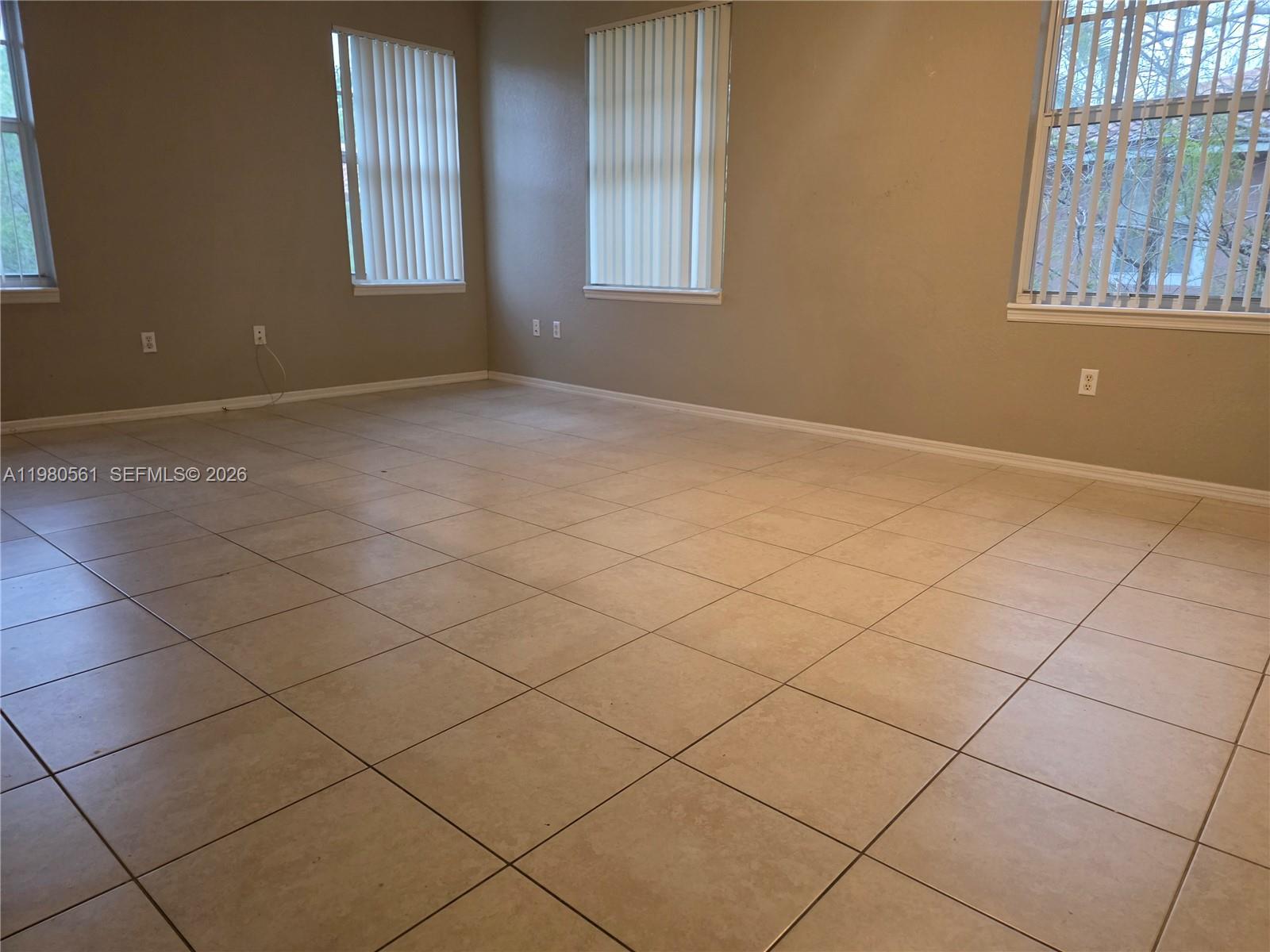 6660 West Sample Road, Unit 6660 Coral Springs, FL 33067 - Photo 19 of 30 a view of an empty room and a window