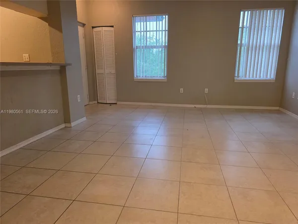 a view of a porch with wooden floor