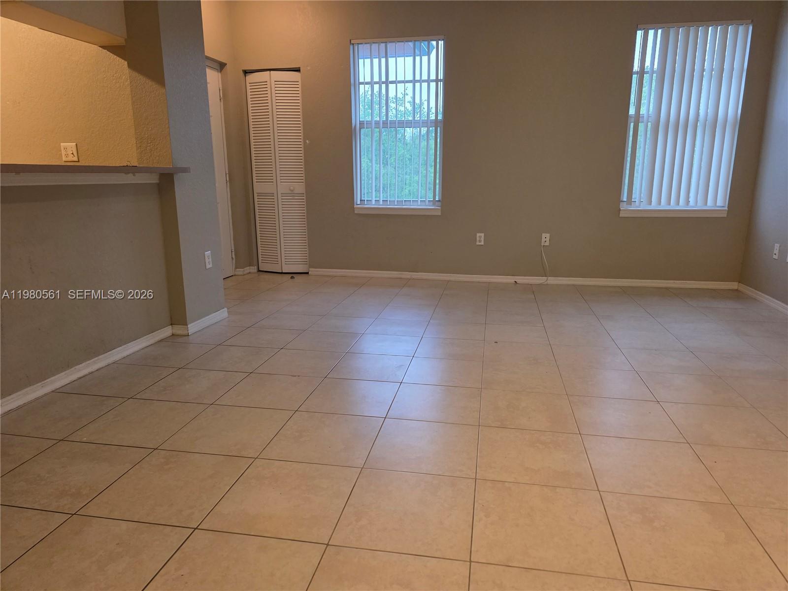 6660 West Sample Road, Unit 6660 Coral Springs, FL 33067 - Photo 20 of 30 a view of an empty room with a window