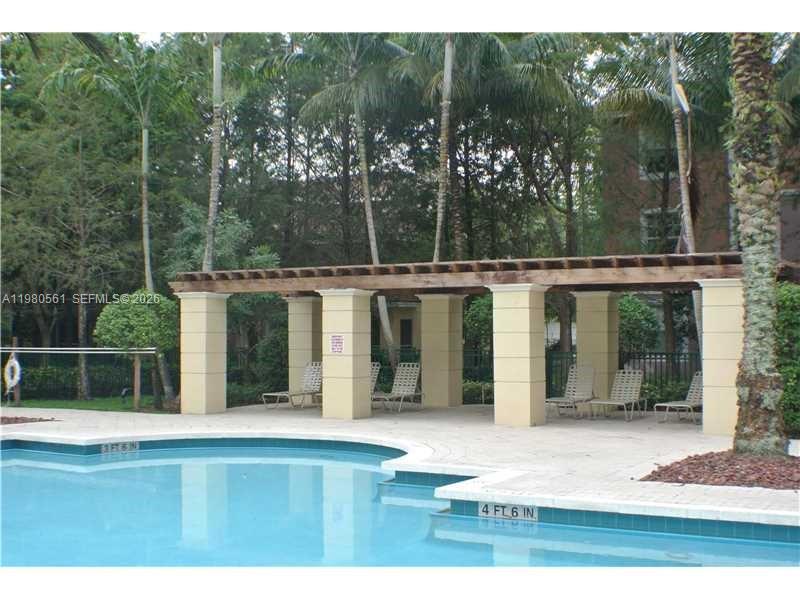 6660 West Sample Road, Unit 6660 Coral Springs, FL 33067 - Photo 24 of 30 a view of a house with backyard