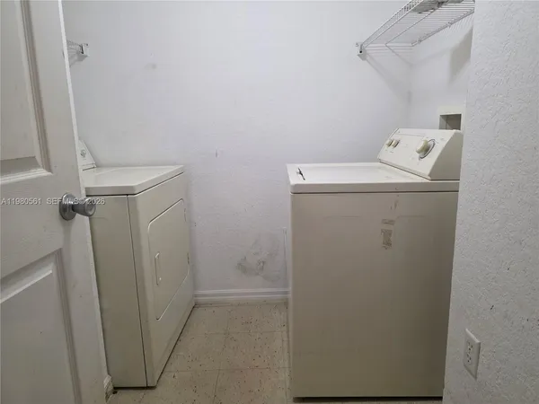 a utility room with dryer and washer