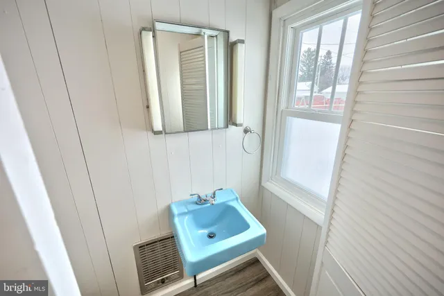 a room with window and a wooden floor