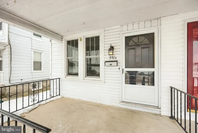a view of a brick house with a large window