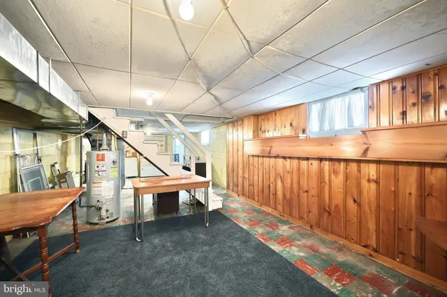 a view of storage and utility room with racks on the wall